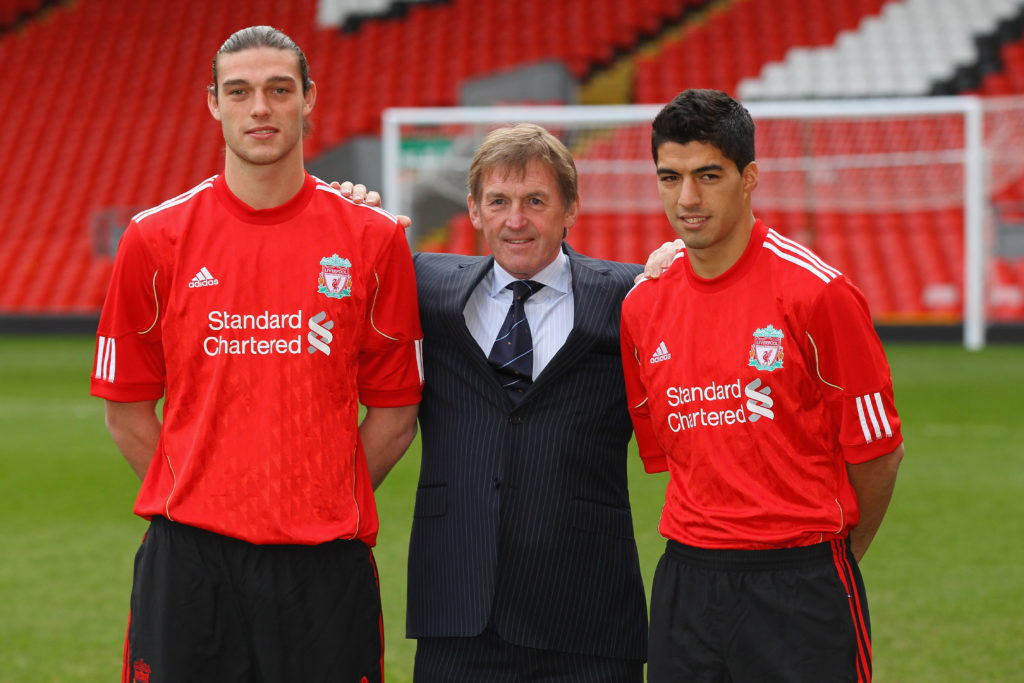 Andy Carroll poses with Kenny Dalglish and Luis Suarez after signing for Liverpool.