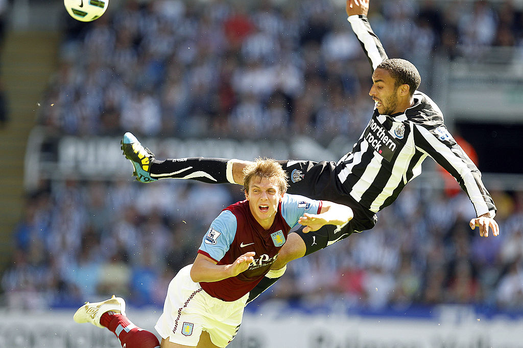 Newcastle United's James Perch (R) vies