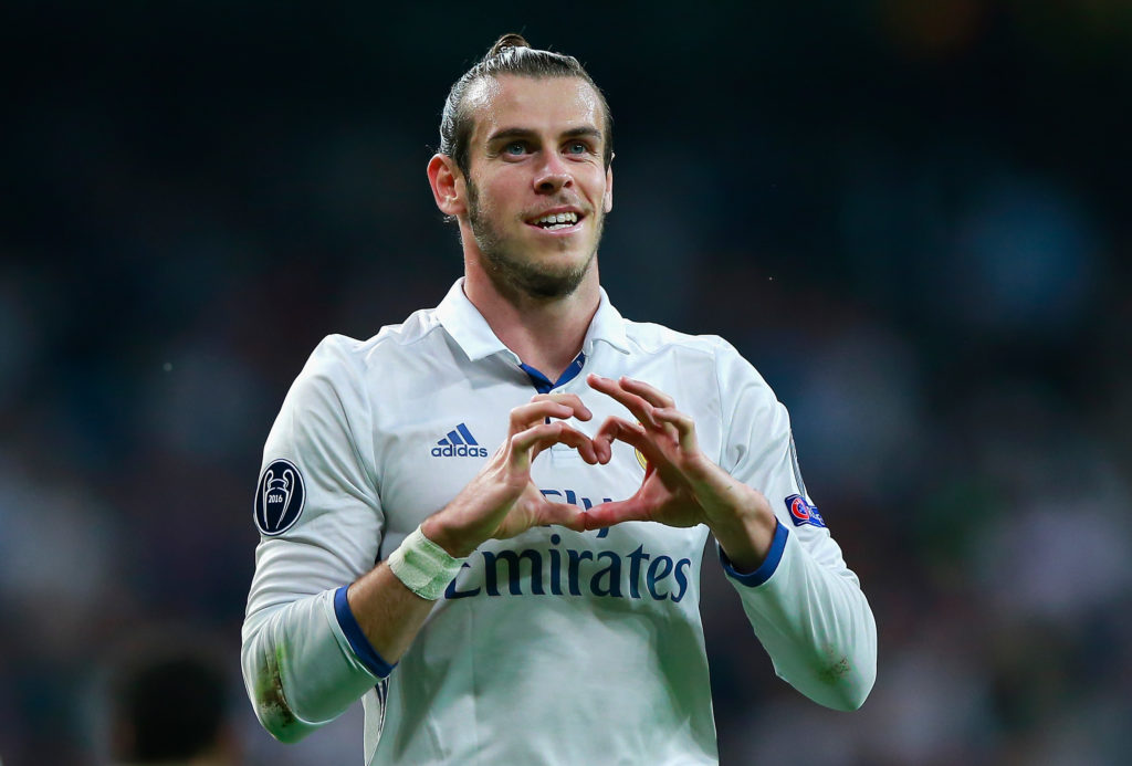 Gareth Bale does a love heart celebration playing for Real Madrid.
