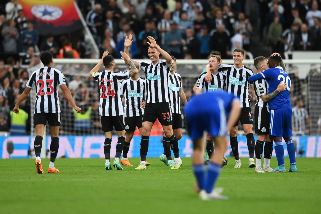Newcastle United players celebrate after securing Champions League football in 2023.