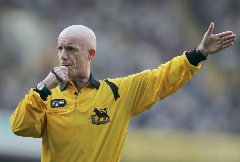 Dermot Gallagher blows his whistle during a Premier League game between Tottenham and Everton.