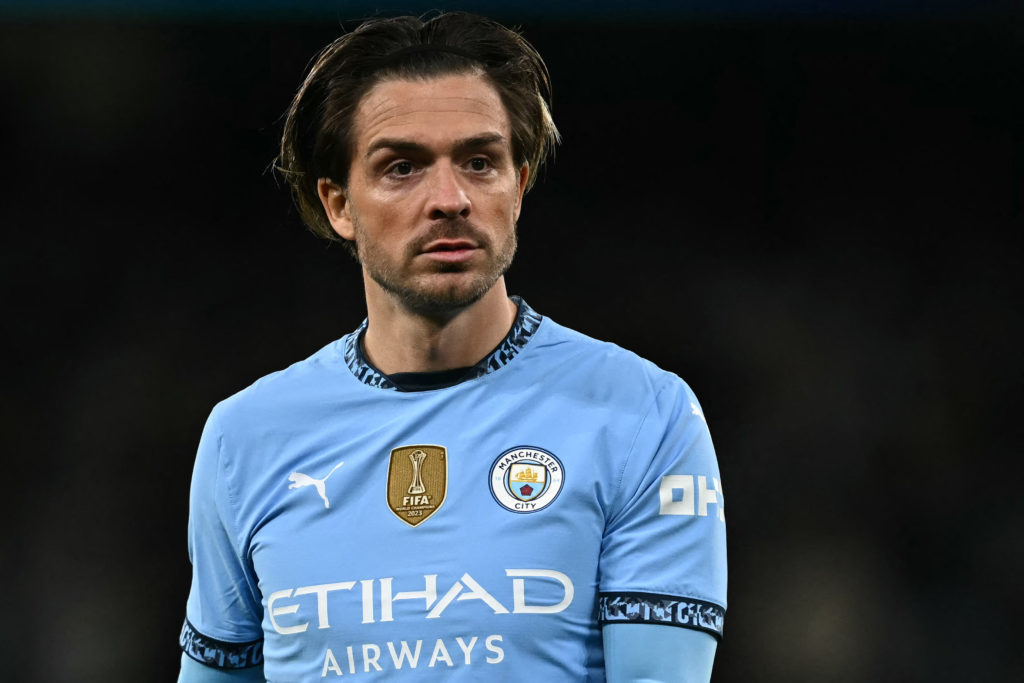 Jack Grealish playing for Manchester City against Manchester United.