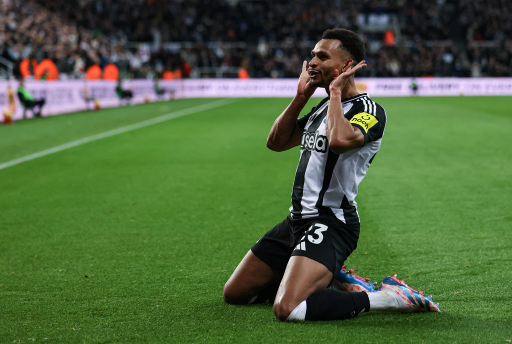 Jacob Murphy celebrates a goal by skidding on his knees and holding up his hands.