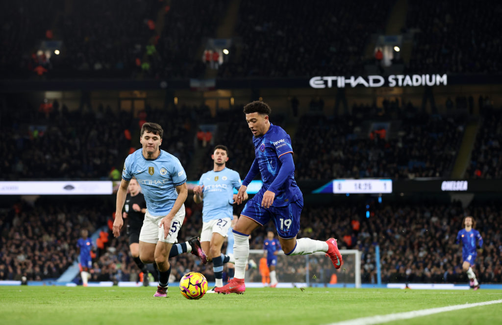 Jadon Sancho carries the ball during a game between Chelsea and Manchester City.