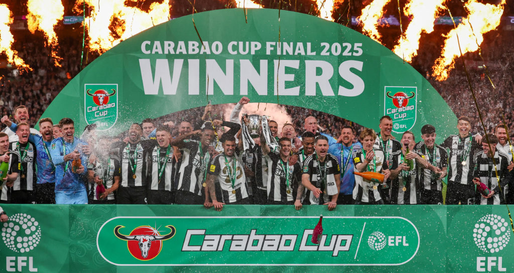 Newcastle players celebrate winning the Carabao Cup final at Wembley.