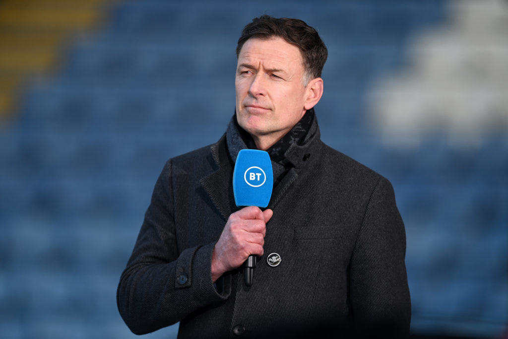 TV Pundit and Former Footballer Chris Sutton looks on ahead of the Premier League match between Leicester City and West Bromwich Albion