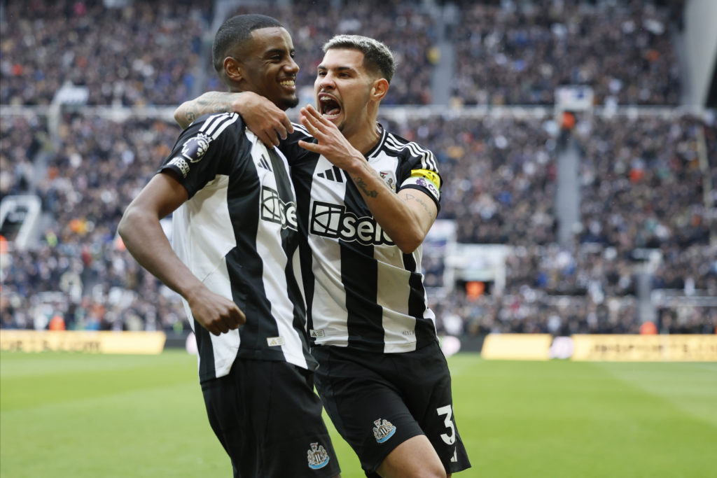 Alexander Isak and Bruno Guimaraes embrace after a goal is scored against Nottingham Forest,