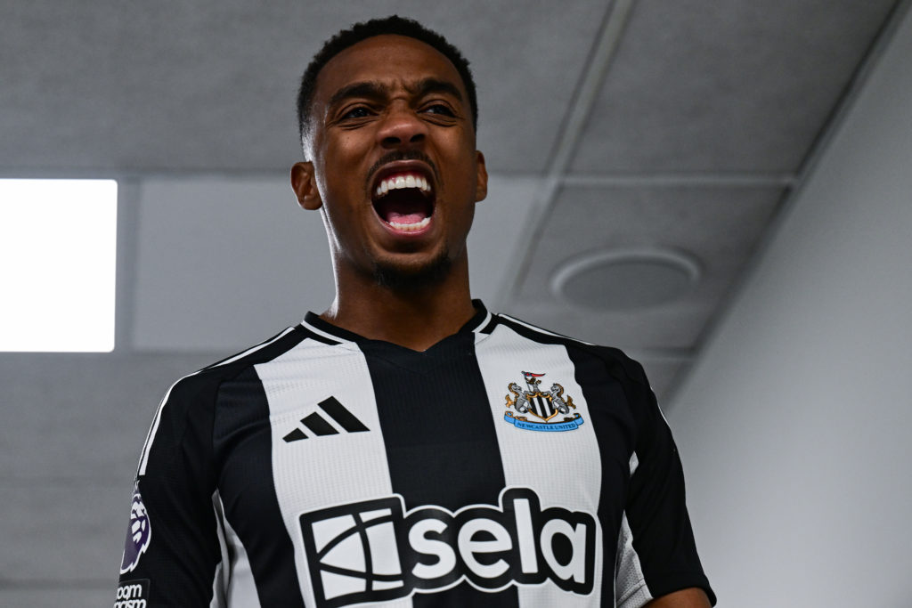 Joe Willock cheers while walking through the tunnel at St. James' Park.