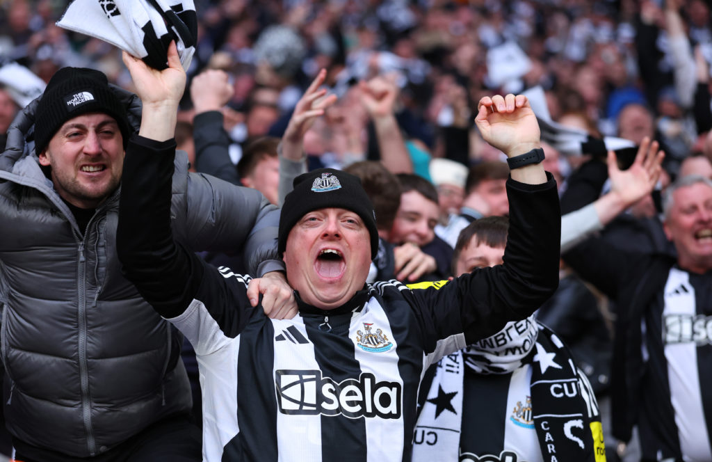 Newcastle United fans celebrate Dan Burn scoring against Liverpool in the Carabao Cup final.