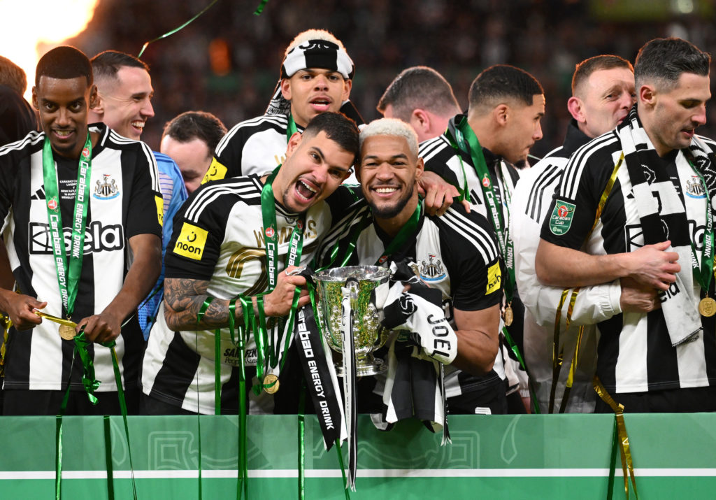 Bruno Guimaraes and Joelinton celebrate with the Carabao Cup trophy at Wembley after Newcastle United's win over Liverpool.