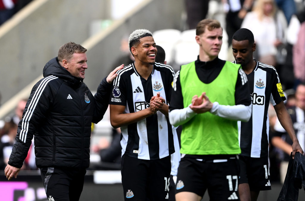 Eddie Howe and William Osula clapping towards supporters after Newcastle United beat Ipswich.