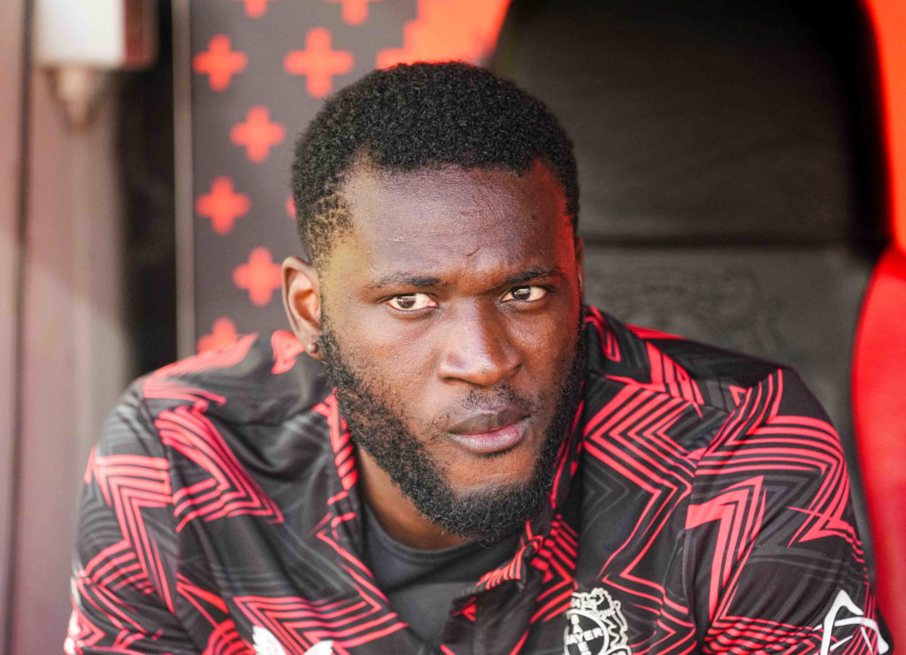 Victor Boniface sitting on the Bayer Leverkusen bench for their Bundesliga game against Borussia Dortmund.
