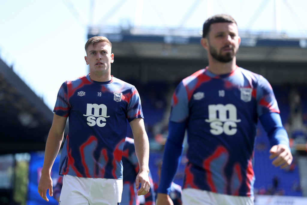 Liam Delap warms up ahead of Ipswich Town's Premier League game against Brentford.
