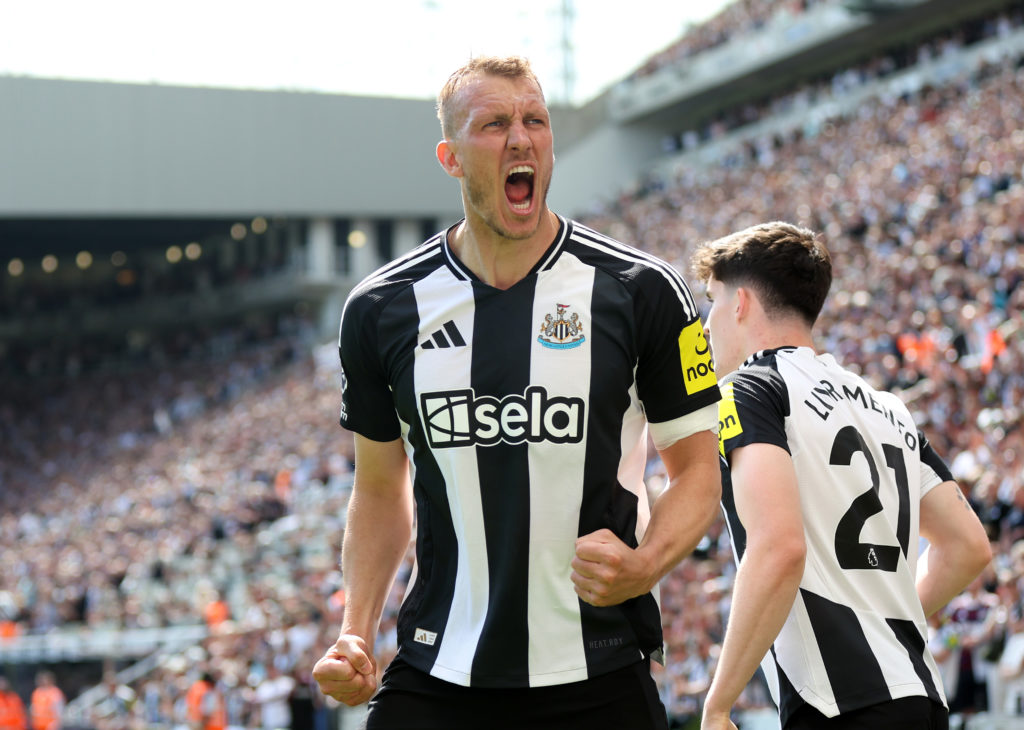 Dan Burn celebrates after Sandro Tonali scores for Newcastle United against Chelsea in the Premier League.