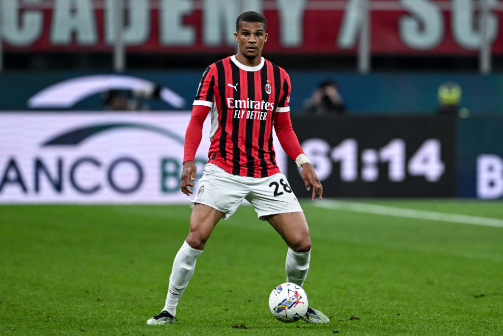 AC Milan defender Malick Thiaw receives the ball against Bologna.