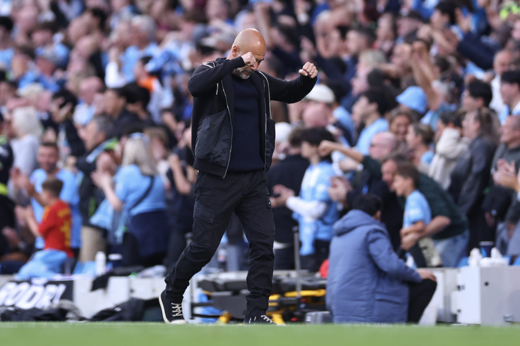 Pep Guardiola celebrates during Manchester City's Premier League win over Bournemouth.