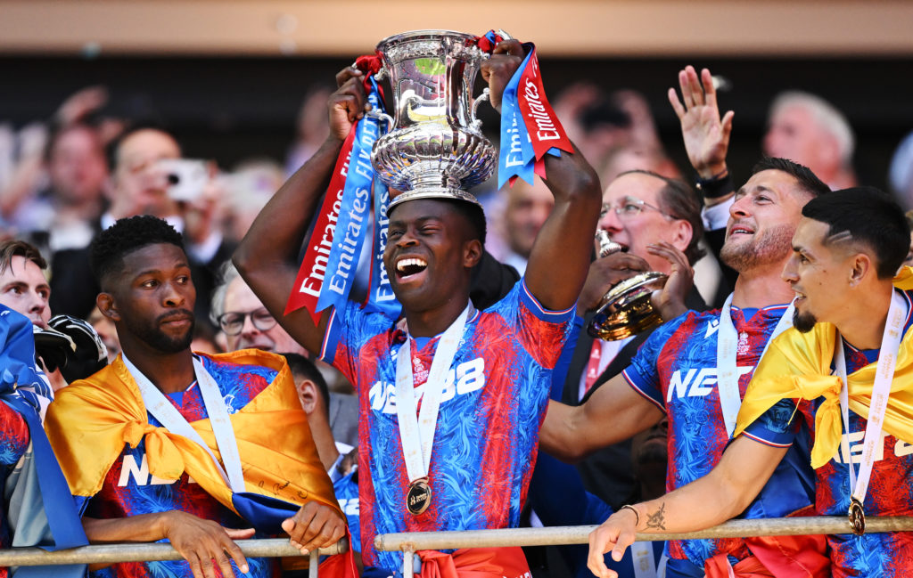 Marc Guehi celebrates with the FA Cup trophy after Crystal Palace beat Manchester City.
