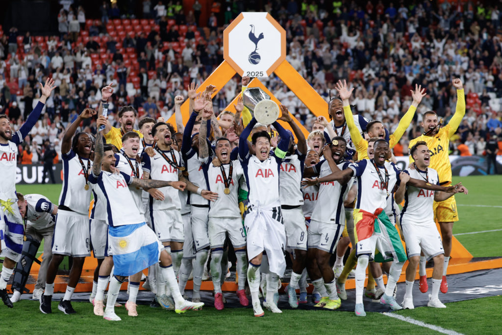 Tottenham Hotspur's South Korean forward Son Heung-min raises the trophy as he celebrates with teammates winning the UEFA Europa League final