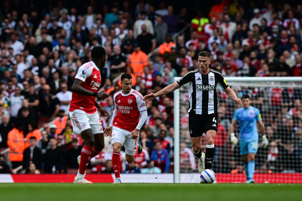 Sven Botman runs with the ball during Newcastle United's Premier League game against Arsenal.