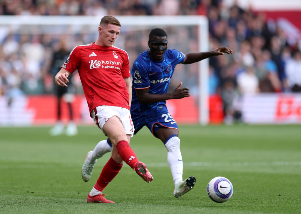 Elliot Anderson passes the ball during Nottingham Forest's Premier League game against Chelsea.