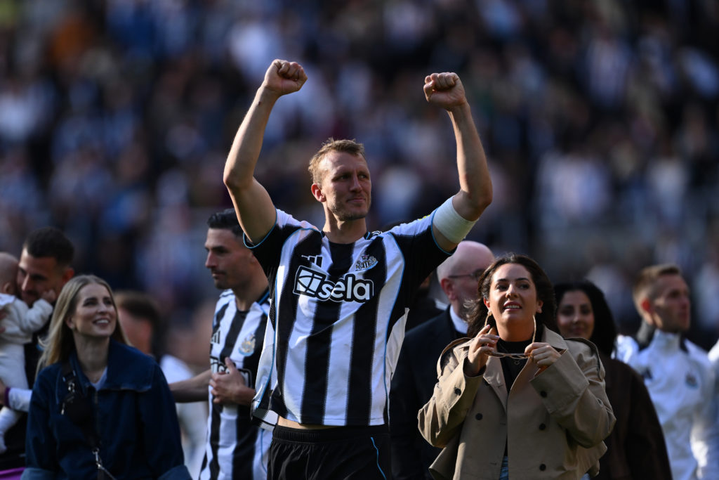 Dan Burn celebrates after Newcastle United qualify for the Champions League.