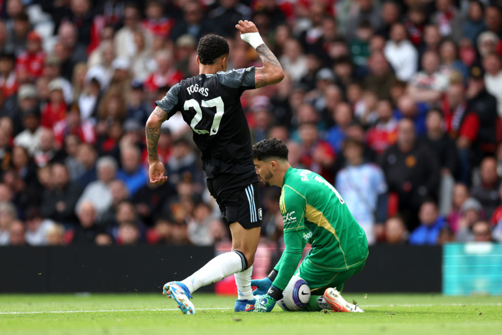 Morgan Rogers challenges Altay Bayindir during Aston Villa's game against Manchester United.