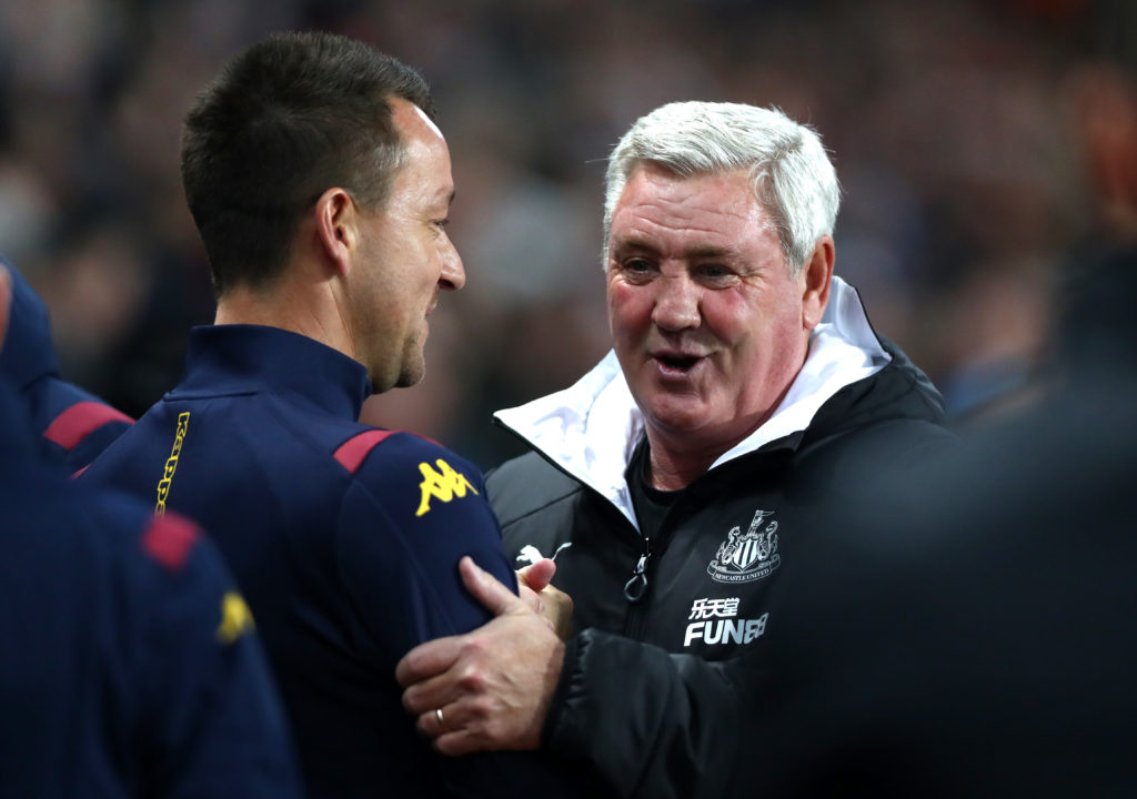 John Terry and Steve Bruce embrace before Aston Villa vs Newcastle United in the Premier League.
