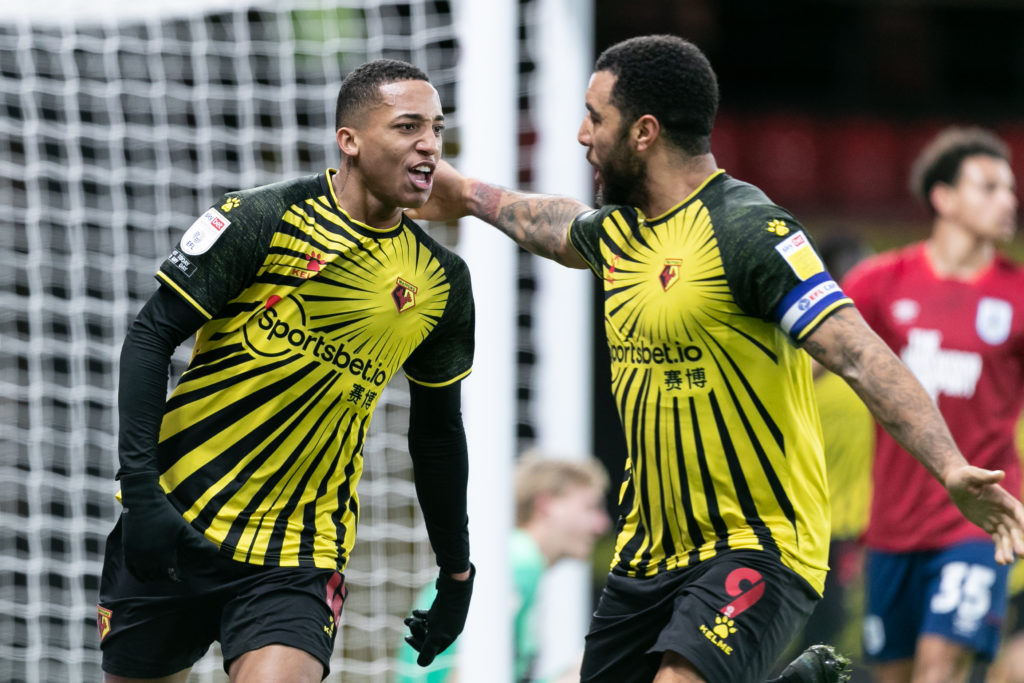 Joao Pedro and Troy Deeney celebrate together after scoring for Watford against Huddersfield Town in the Championship.