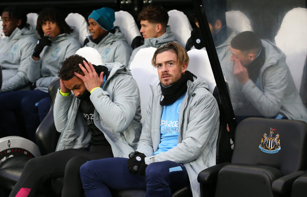 Jack Grealish sat on the bench before Newcastle United play Manchester City at St James' Park.