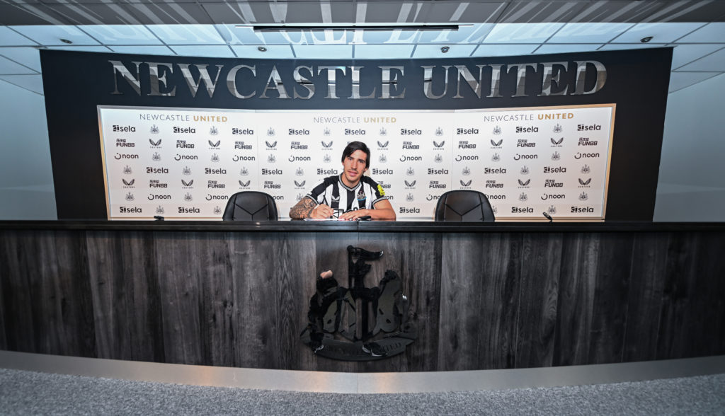 Sandro Tonali poses for an official photo after signing for Newcastle United from AC Milan.