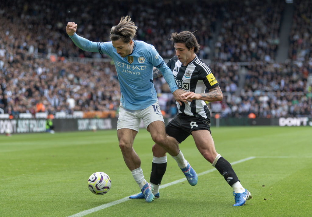 Jack Grealish and Sandro Tonali challenge for the ball during Newcastle United vs Manchester City at St James' Park.
