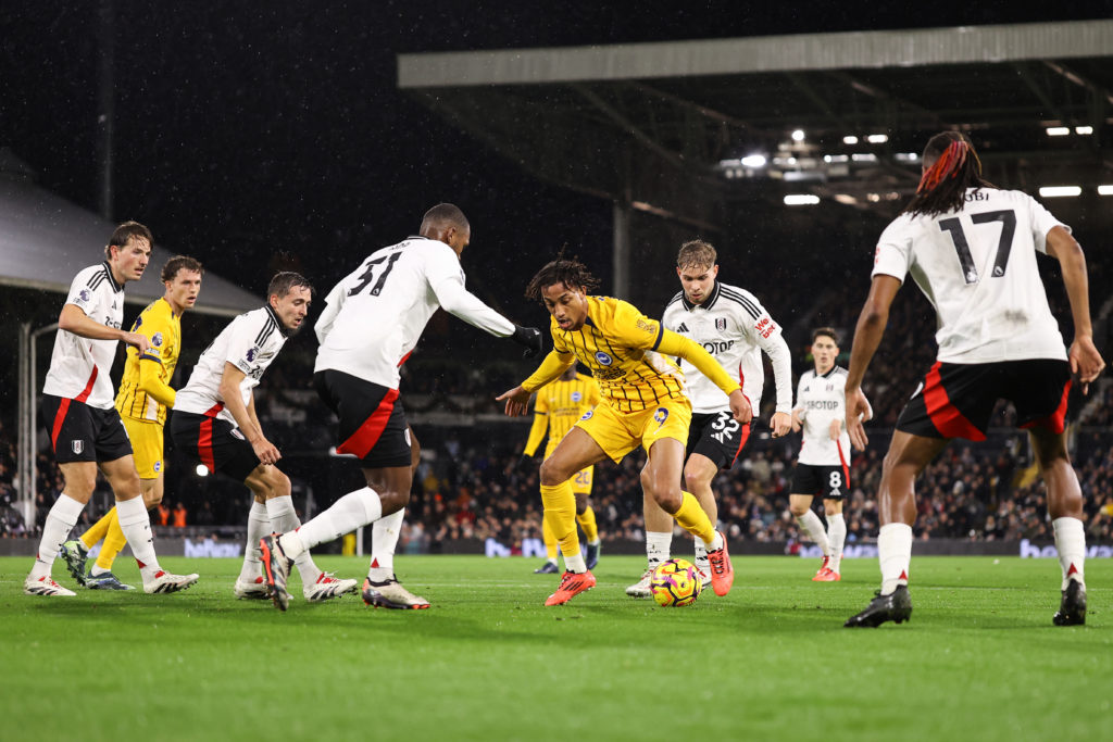 Brighton's Joao Pedro is surrounded by Fulham players during a Premier League game at Craven Cottage.