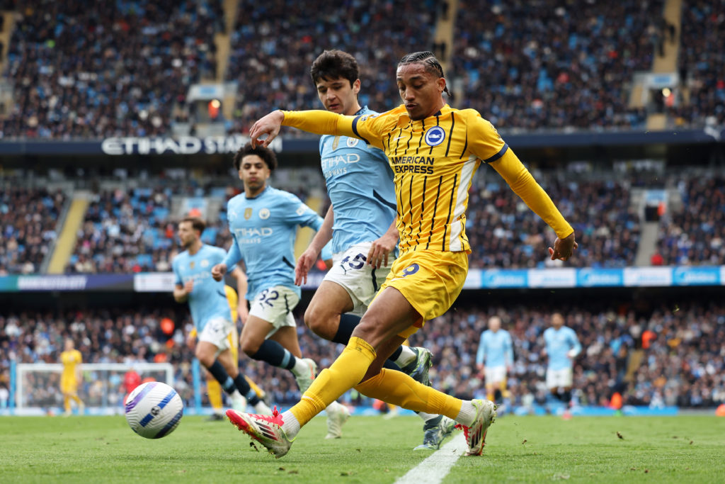 Brighton attacker Joao Pedro strikes the ball during a Premier League game against Manchester City.
