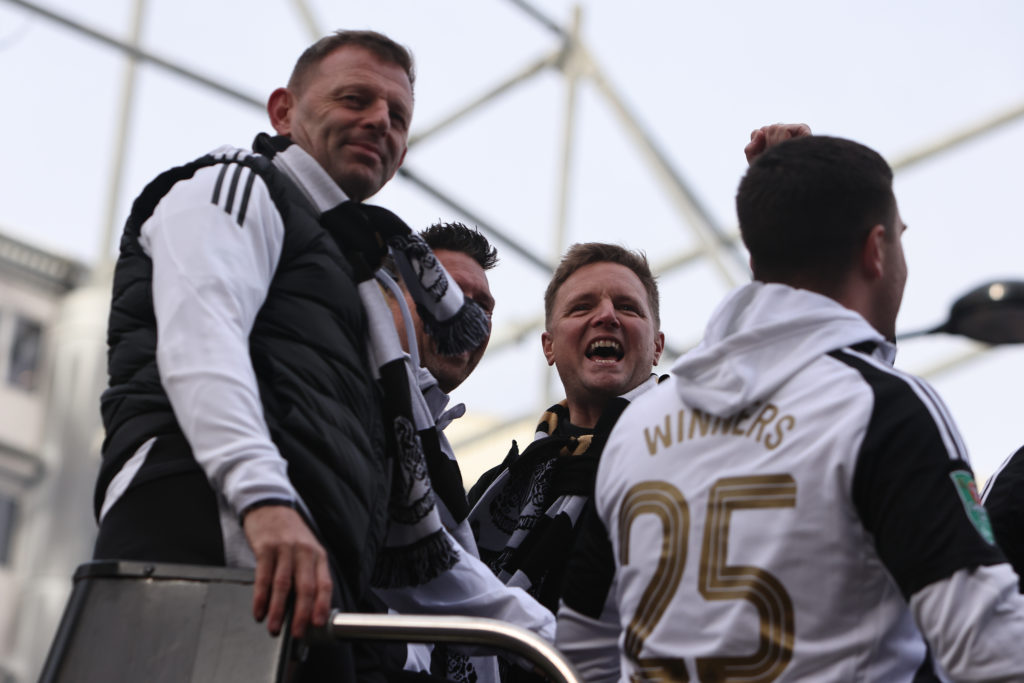 Newcastle United manager Eddie Howe raises his fist to the crowd during the Carabao Cup trophy parade.