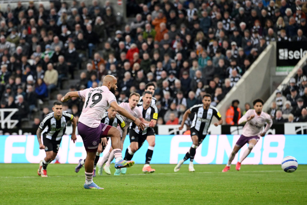 Bryan Mbeumo scores a penalty for Brentford against Newcastle United at St James' Park.