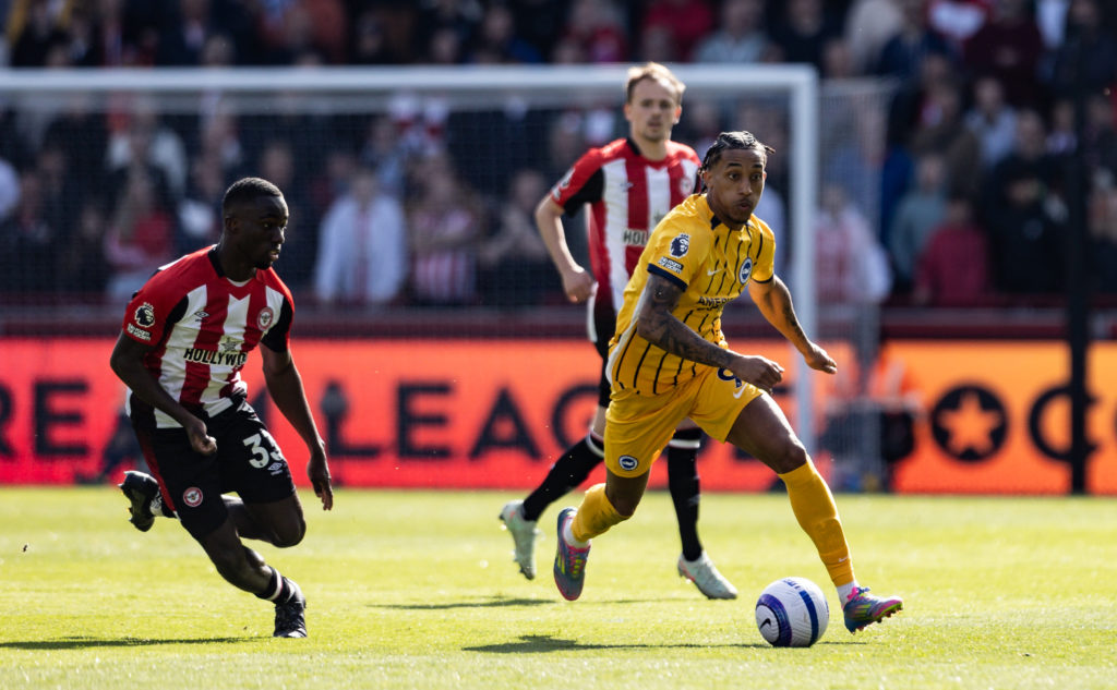 Brighton attacker runs with the ball during a Premier League game against Brentford.