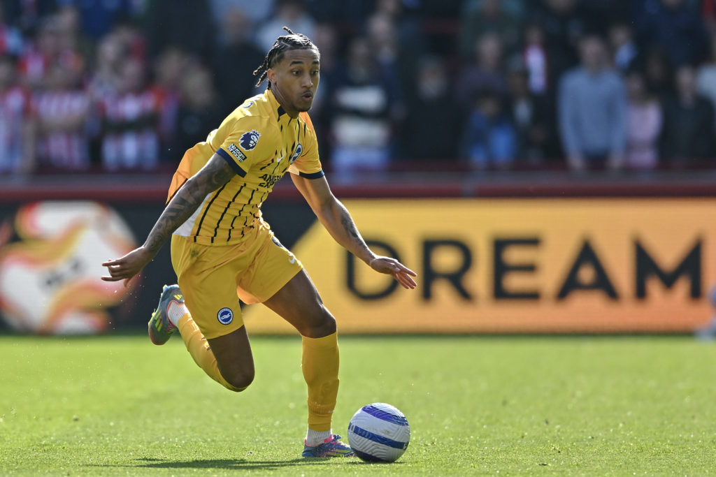 Joao Pedro running with the ball during a Premier League game between Brentford and Brighton.