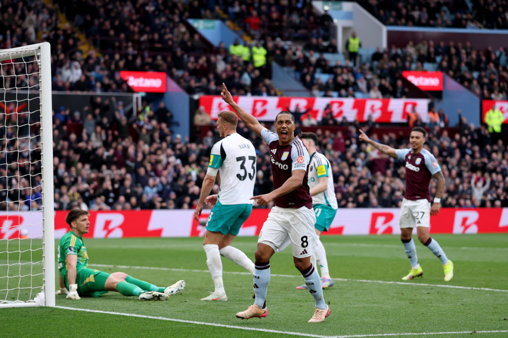 Youri Tielemans of Aston Villa celebrates after Dan Burn of Newcastle United scores an own goal.