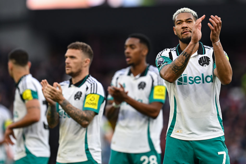 Joelinton applauds the travelling Newcastle United fans after their defeat to Aston Villa.