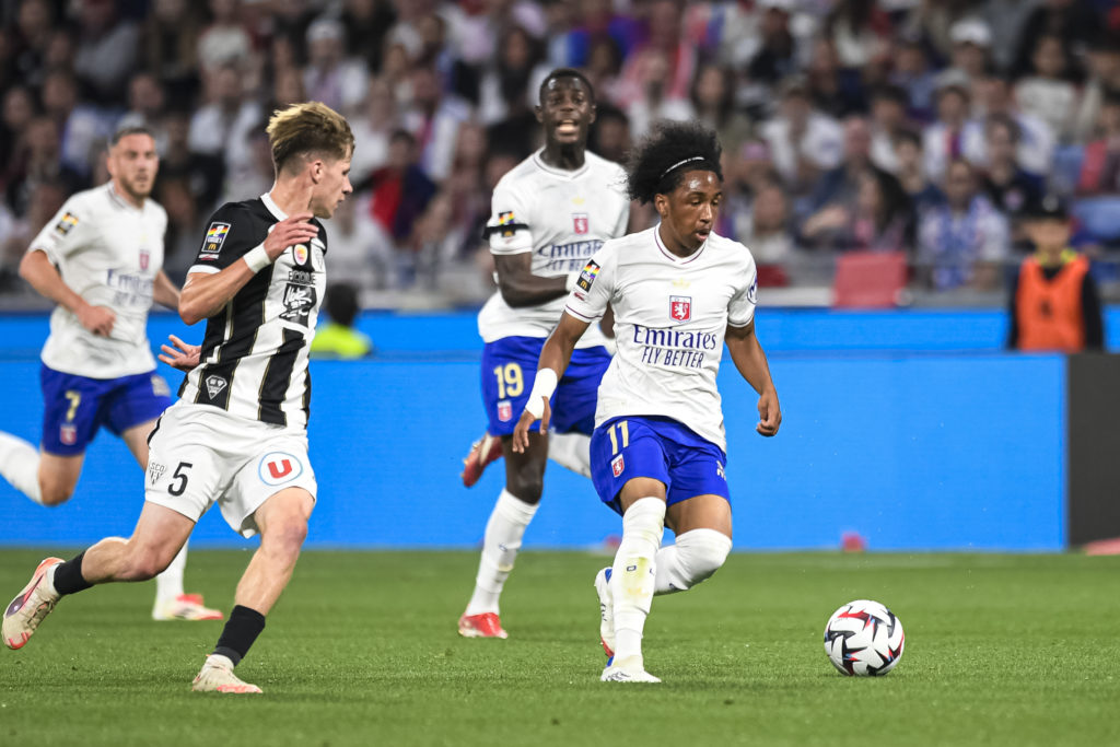 Malick Fofana carries the ball during a Ligue 1 game between Lyon and Angers SCO