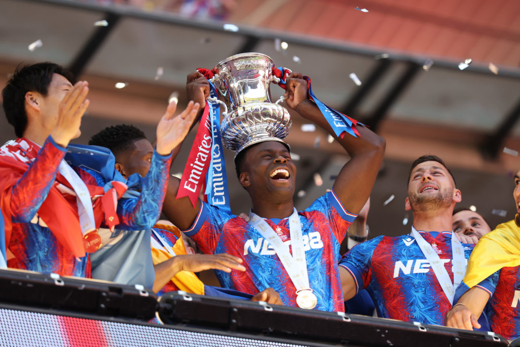 Marc Guehi puts the FA Cup trophy on his head after Crystal Palace's win over Manchester City at Wembley.