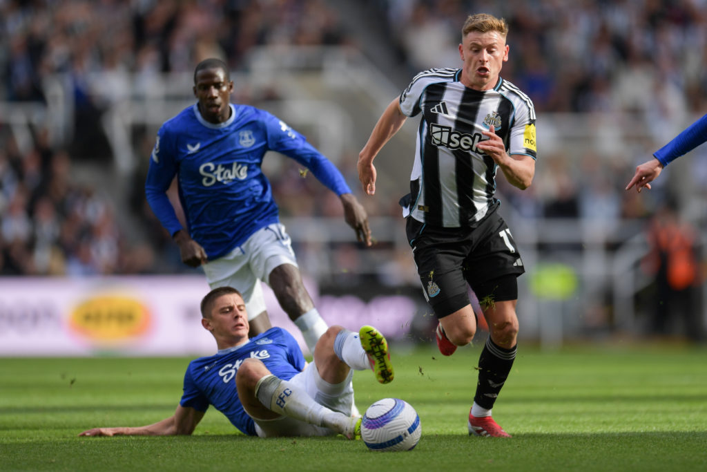 Harvey Barnes running with the ball during Newcastle United's Premier League game against Everton.