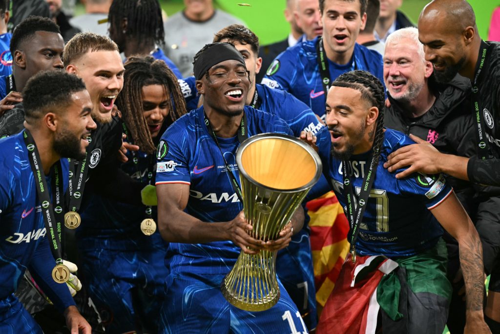 Noni Madueke celebrates with the UEFA Conference League trophy after beating Real Betis in the final.