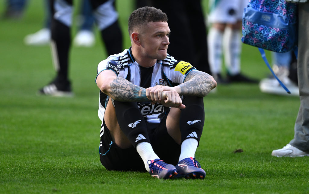 Kieran Trippier sits on the pitch after Newcastle United's Premier League loss against Everton.