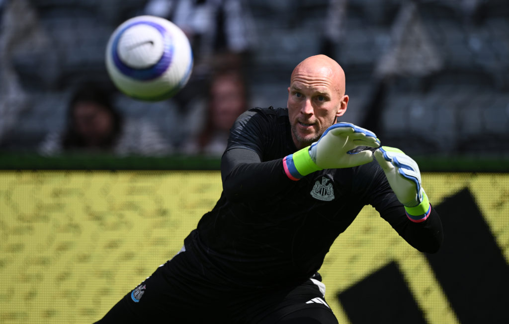 John Ruddy dives to save a shot during the warmup before Newcastle United vs Everton in the Premier League.