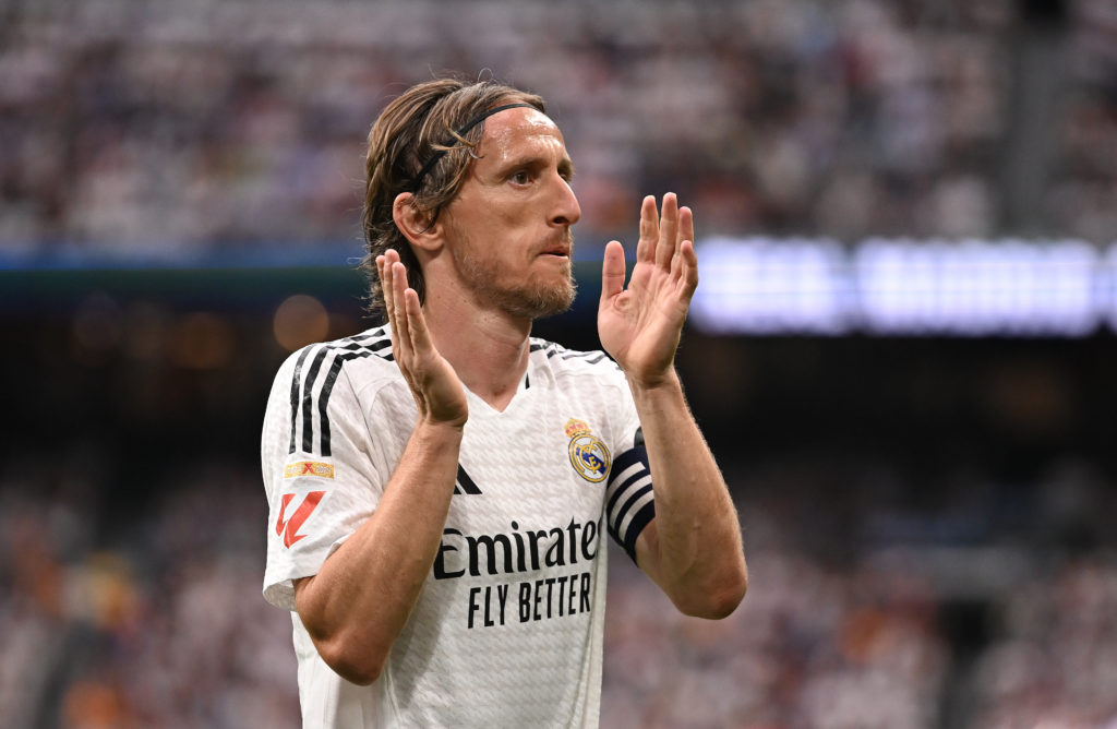 Luka Modric claps towards Real Madrid fans after a La Liga match.