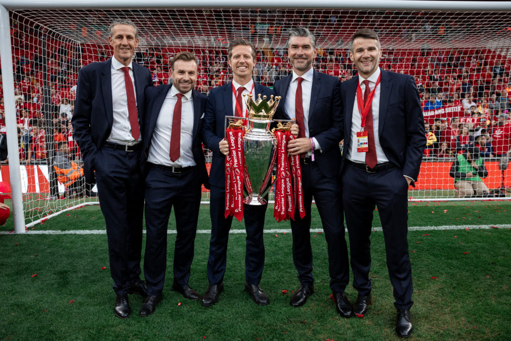 Liverpool technical director Julian Ward celebrates with the Premier League trophy.