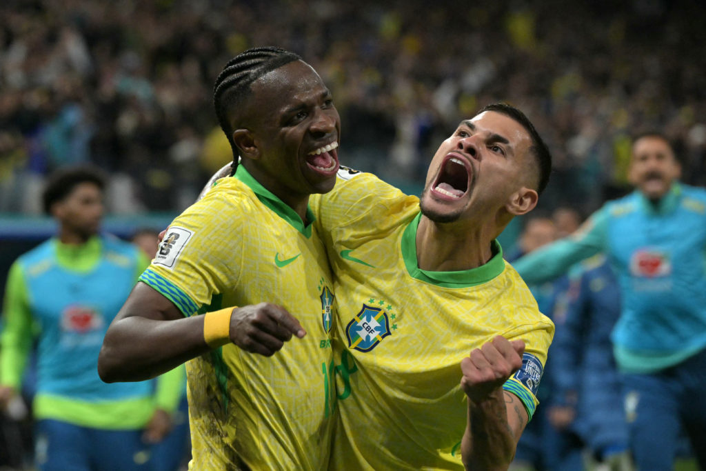 Bruno Guimaraes celebrates with Vinicius Junior after the Real Madrid star scored Brazil's only goal of the game against Paraguay to qualify for the 2026 World Cup.