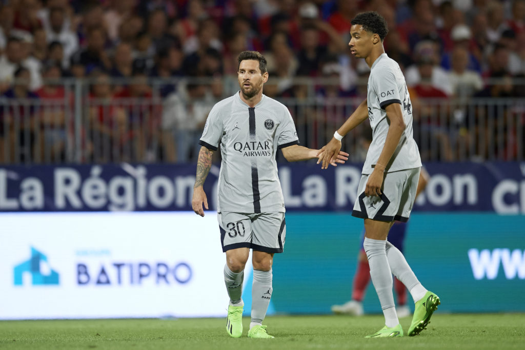 Lionel Messi and Hugo Ekitike playing for PSG against Clermont Foot in 2022.