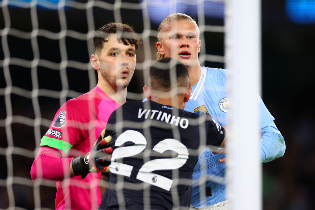 James Trafford jostles with Erling Haaland during Manchester City vs Burnley.
